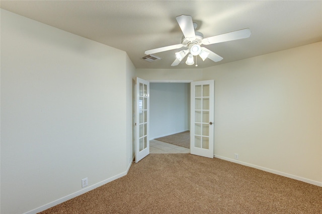 20218 Cypresswood Gln, Spring, TX 77373 - spare room featuring french doors, light colored carpet, and a ceiling fan