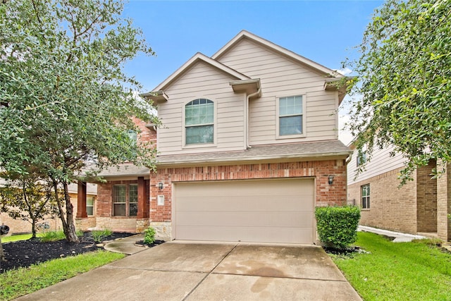 187 Black Swan Pl, The Woodlands, TX 77354 - traditional-style house featuring concrete driveway, a garage, brick siding, and a shingled roof