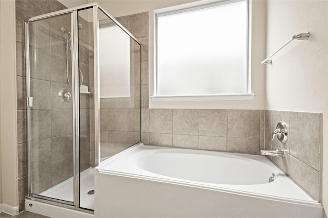 187 Black Swan Pl, The Woodlands, TX 77354 - full bathroom featuring a bath and a shower stall
