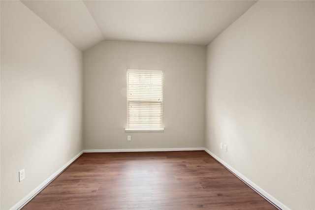 187 Black Swan Pl, The Woodlands, TX 77354 - unfurnished room with wood finished floors and vaulted ceiling