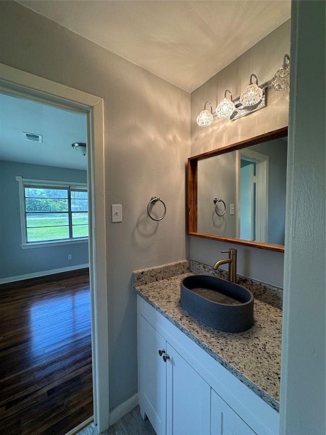 14410 Henry Rd, Houston, TX 77060 - bathroom featuring vanity and wood finished floors