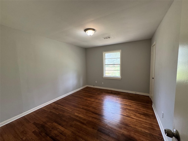 14410 Henry Rd, Houston, TX 77060 - unfurnished room with dark wood-style floors and baseboards