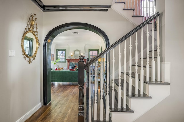 2248 Robinhood St, Houston, TX 77005 - staircase with wood finished floors and arched walkways