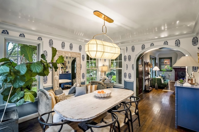 2248 Robinhood St, Houston, TX 77005 - dining space featuring arched walkways, dark wood-style flooring, and ornamental molding