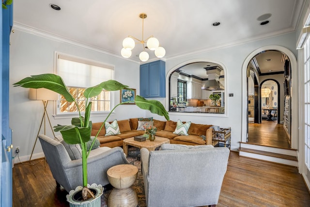 2248 Robinhood St, Houston, TX 77005 - living room featuring arched walkways, crown molding, a chandelier, healthy amount of natural light, and dark wood-style floors