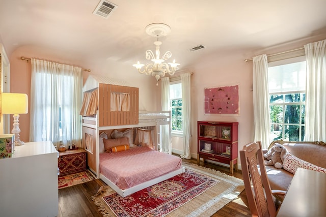 2248 Robinhood St, Houston, TX 77005 - bedroom featuring a chandelier, wood finished floors, and multiple windows