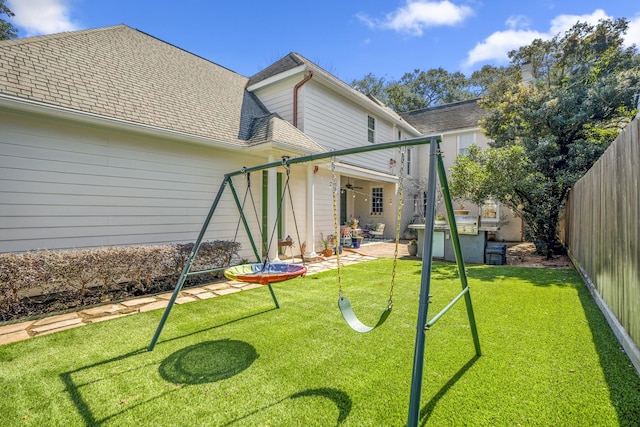 2248 Robinhood St, Houston, TX 77005 - back of property featuring ceiling fan, a fenced backyard, a patio area, and a shingled roof