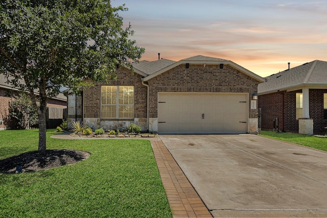 23719 Scotsman Dr, Katy, TX 77493 - ranch-style home featuring an attached garage, driveway, a front yard, brick siding, and stone siding