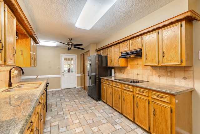 108 Laurel Valley Dr, West Columbia, TX 77486 - kitchen with black appliances, under cabinet range hood, tasteful backsplash, a textured ceiling, and a ceiling fan