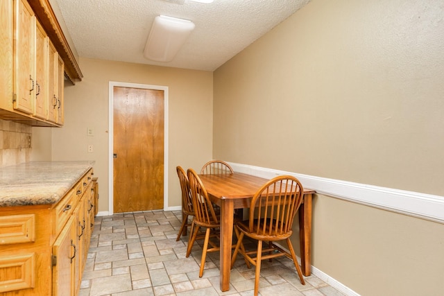 108 Laurel Valley Dr, West Columbia, TX 77486 - dining room featuring a textured ceiling and light stone finish floors