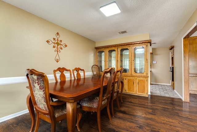 108 Laurel Valley Dr, West Columbia, TX 77486 - dining space featuring a textured ceiling and wood finished floors