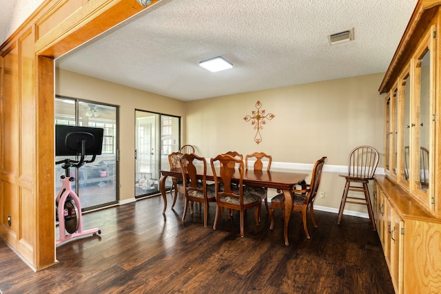 108 Laurel Valley Dr, West Columbia, TX 77486 - dining room with dark wood-type flooring and a textured ceiling