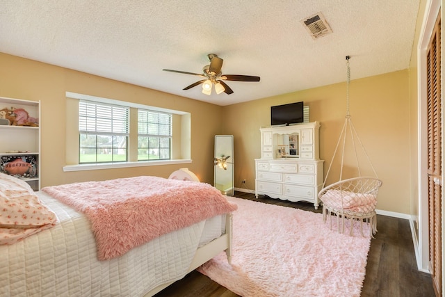 108 Laurel Valley Dr, West Columbia, TX 77486 - bedroom featuring dark wood-style floors, a textured ceiling, and ceiling fan
