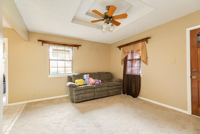 108 Laurel Valley Dr, West Columbia, TX 77486 - living area featuring ceiling fan, carpet floors, a raised ceiling, and a textured ceiling
