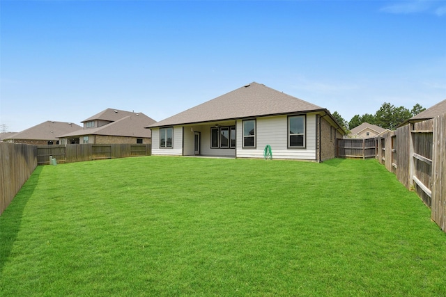 12806 Durham Creek Ln, Tomball, TX 77375 - rear view of house featuring a fenced backyard and roof with shingles