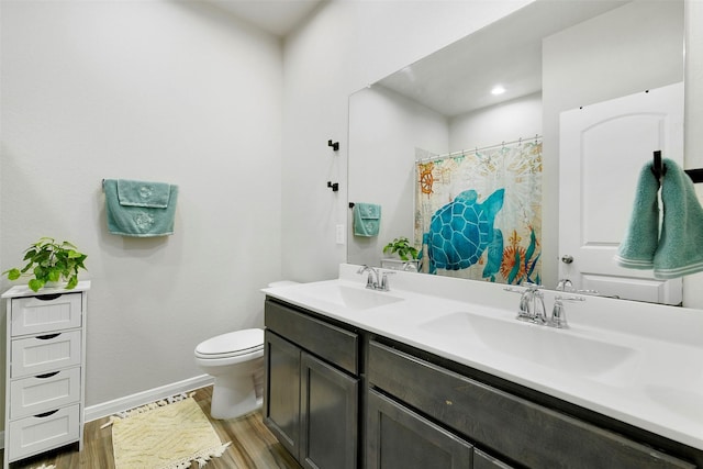 12806 Durham Creek Ln, Tomball, TX 77375 - bathroom featuring double vanity, wood finished floors, and curtained shower