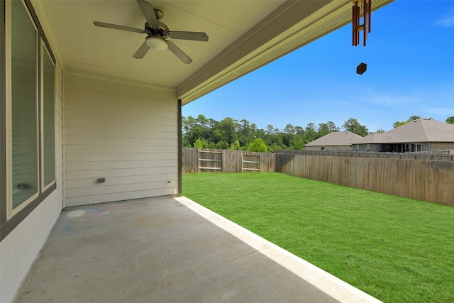 12806 Durham Creek Ln, Tomball, TX 77375 - fenced backyard featuring a patio and a ceiling fan