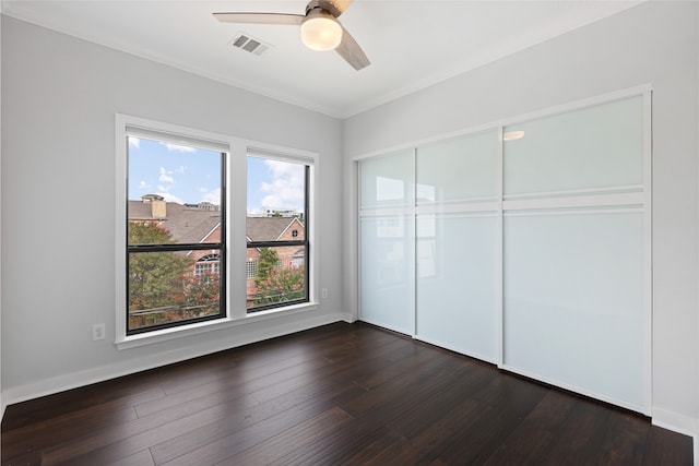 802 Malone St Unit A, Houston, TX 77007 - unfurnished bedroom featuring dark wood finished floors, ornamental molding, a closet, and ceiling fan
