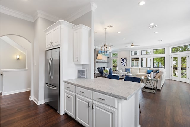 802 Malone St Unit A, Houston, TX 77007 - kitchen with freestanding refrigerator, recessed lighting, ceiling fan, a fireplace, and white cabinetry
