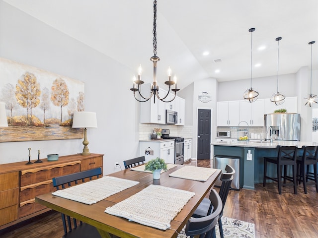 6003 Rivergrove Bend Dr, Humble, TX 77346 - dining space featuring a chandelier, vaulted ceiling, dark wood finished floors, and recessed lighting