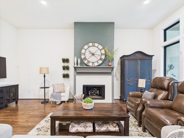 6003 Rivergrove Bend Dr, Humble, TX 77346 - living area featuring wood finished floors, a fireplace, and recessed lighting