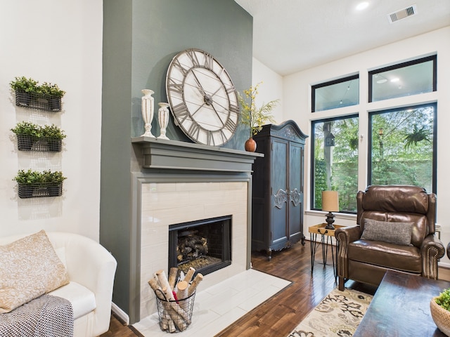 6003 Rivergrove Bend Dr, Humble, TX 77346 - living room with dark wood-style floors, a fireplace, and recessed lighting