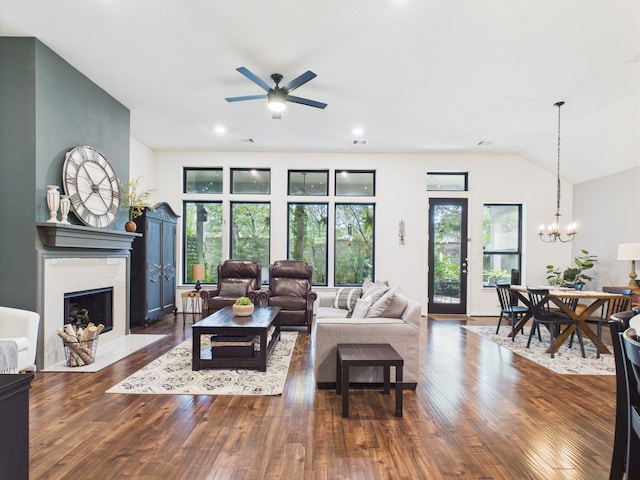 6003 Rivergrove Bend Dr, Humble, TX 77346 - living area with a ceiling fan, a fireplace, wood finished floors, a chandelier, and vaulted ceiling