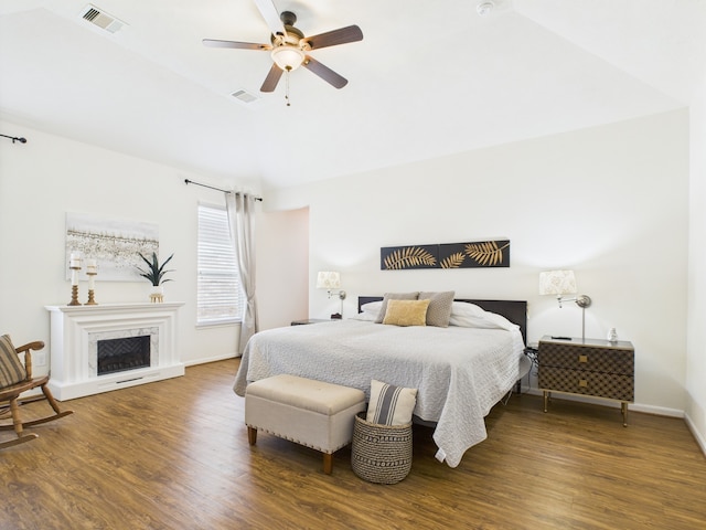 6003 Rivergrove Bend Dr, Humble, TX 77346 - bedroom featuring wood finished floors, a fireplace, and ceiling fan