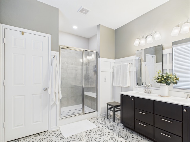 6003 Rivergrove Bend Dr, Humble, TX 77346 - full bath featuring a shower stall, double vanity, and tile patterned flooring