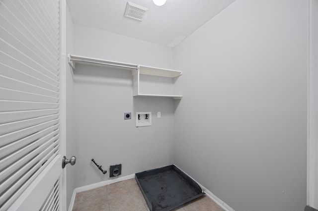 3307 La Seine Ln, Spring, TX 77388 - washroom featuring washer hookup, hookup for an electric dryer, and tile patterned floors