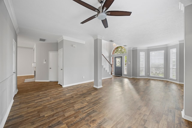 3307 La Seine Ln, Spring, TX 77388 - unfurnished living room featuring a ceiling fan, dark wood-type flooring, ornamental molding, and stairway