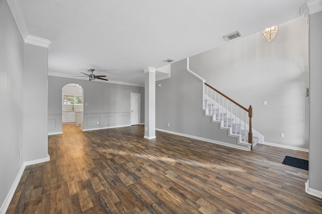 3307 La Seine Ln, Spring, TX 77388 - unfurnished living room featuring ceiling fan, crown molding, dark wood-style flooring, a decorative wall, and stairs