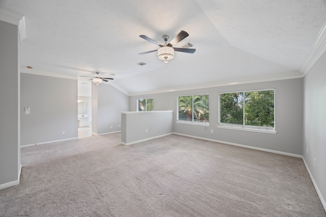 3307 La Seine Ln, Spring, TX 77388 - spare room featuring a ceiling fan, vaulted ceiling, healthy amount of natural light, carpet floors, and crown molding