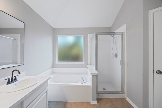 3307 La Seine Ln, Spring, TX 77388 - bathroom featuring vanity, a bath, a shower stall, tile patterned flooring, and lofted ceiling
