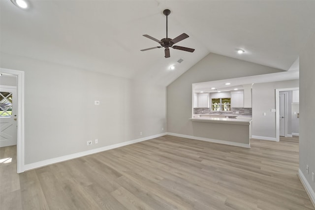 2915 Katy Hockley Rd, Katy, TX 77493 - unfurnished living room featuring a ceiling fan, lofted ceiling, light wood-style flooring, and recessed lighting