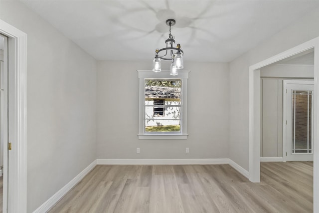 2915 Katy Hockley Rd, Katy, TX 77493 - unfurnished room with a chandelier and light wood-style floors
