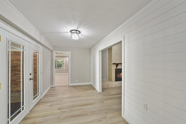 2915 Katy Hockley Rd, Katy, TX 77493 - hall with light wood finished floors and a textured ceiling