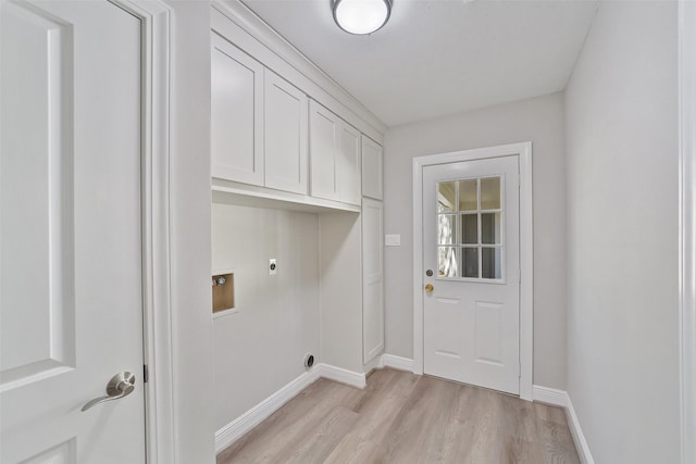 2915 Katy Hockley Rd, Katy, TX 77493 - laundry area featuring hookup for an electric dryer, light wood finished floors, cabinet space, and washer hookup