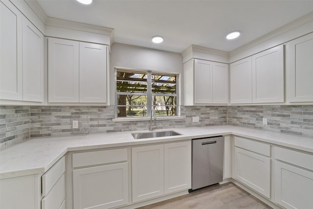 2915 Katy Hockley Rd, Katy, TX 77493 - kitchen featuring dishwasher, white cabinetry, and tasteful backsplash