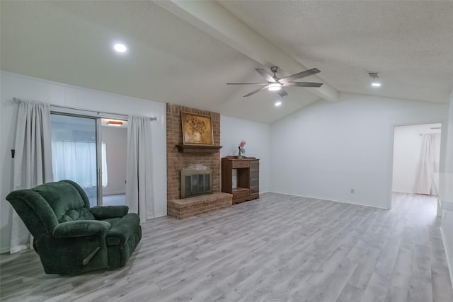 5026 Algernon Dr, Spring, TX 77373 - living area with a ceiling fan, light wood finished floors, and a brick fireplace