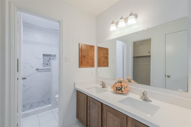 5026 Algernon Dr, Spring, TX 77373 - bathroom with double vanity, a stall shower, and tile patterned flooring