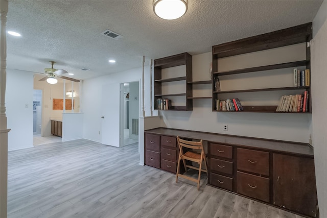 5026 Algernon Dr, Spring, TX 77373 - unfurnished office with a textured ceiling, built in desk, light wood-style flooring, ceiling fan, and recessed lighting