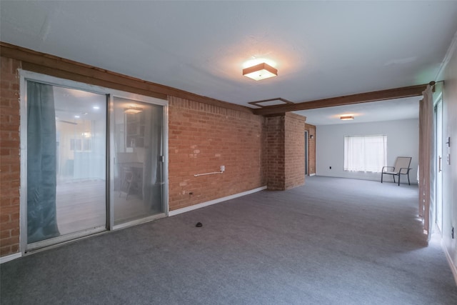 5026 Algernon Dr, Spring, TX 77373 - carpeted empty room with brick wall and baseboards