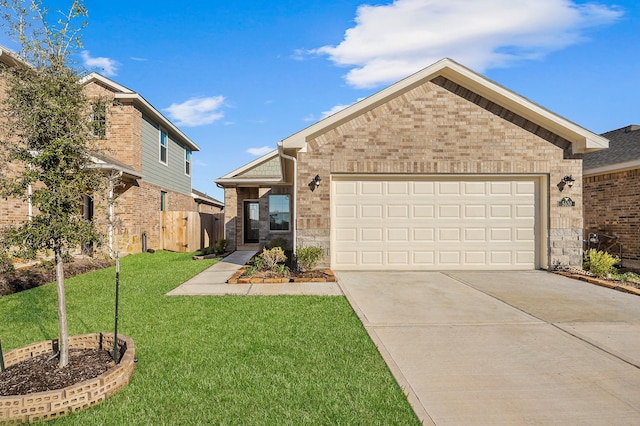 5630 Tabula Rasa Dr, Katy, TX 77493 - view of front of home featuring concrete driveway, a front lawn, brick siding, and an attached garage