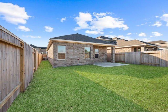5630 Tabula Rasa Dr, Katy, TX 77493 - rear view of property featuring a patio, a fenced backyard, brick siding, and a shingled roof