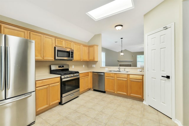 6611 Atasca Creek Dr, Humble, TX 77346 - kitchen with appliances with stainless steel finishes, lofted ceiling, light countertops, and decorative light fixtures