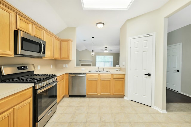 6611 Atasca Creek Dr, Humble, TX 77346 - kitchen with stainless steel appliances, light countertops, ceiling fan, and pendant lighting