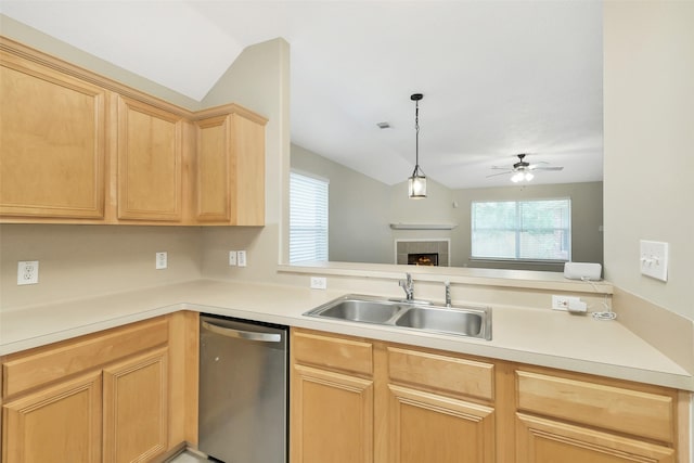 6611 Atasca Creek Dr, Humble, TX 77346 - kitchen featuring stainless steel dishwasher, vaulted ceiling, light brown cabinets, ceiling fan, and healthy amount of natural light