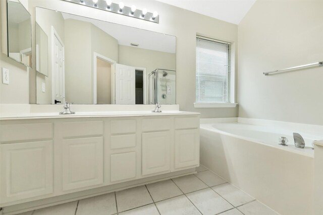 6611 Atasca Creek Dr, Humble, TX 77346 - full bath featuring a shower stall, a bath, double vanity, and tile patterned flooring