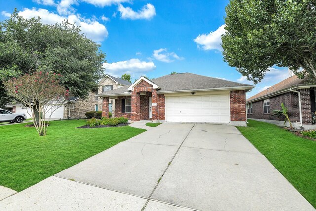 6611 Atasca Creek Dr, Humble, TX 77346 - traditional-style house with brick siding, concrete driveway, a garage, and a front yard